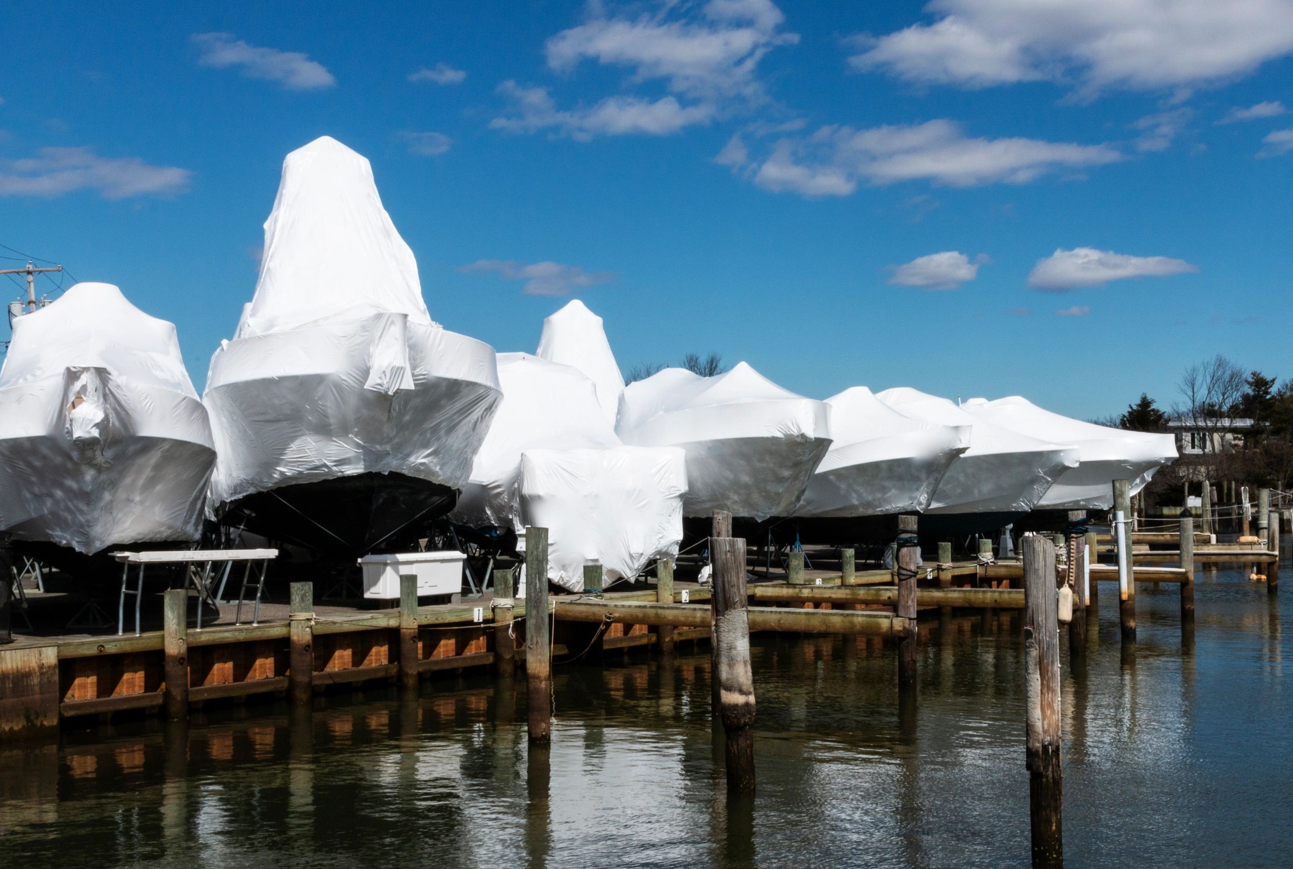 Boat lift canopy cover at a waterfront dock